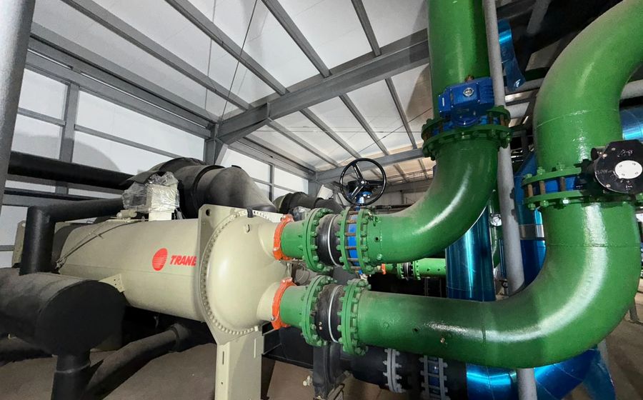 Centrifugal chiller connected to primary headers and isolation valves